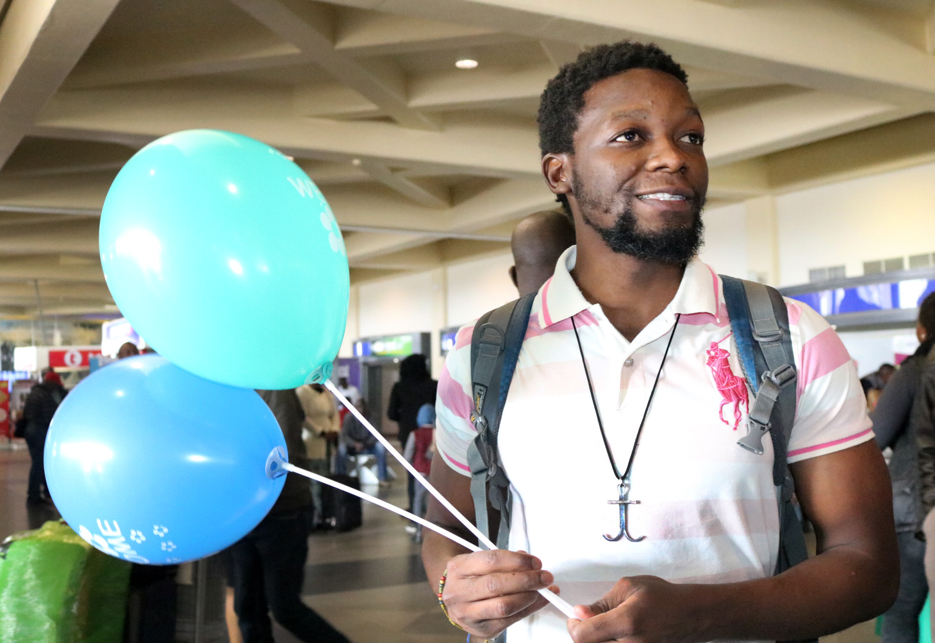 Tawanda Chandiwana exhibits a broad smile as he arrives back home in Zimbabwe following a 56-day detention in the Philippines. Photo by Taurai Emmanuel Maforo, UMNS.