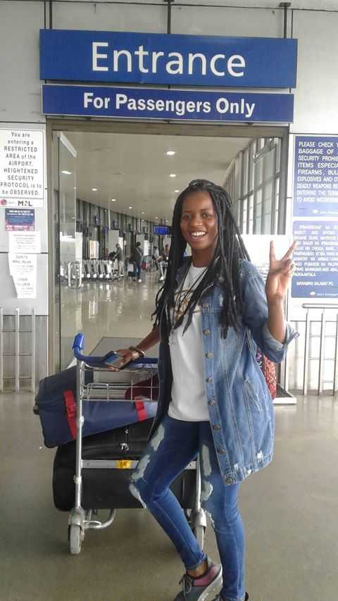 United Methodist missionary Miracle Osman prepares to depart Ninoy Aquino International Airport in Manila, Philippines. Osman has returned to her home in Malawi. Photo by Marie Villalon.