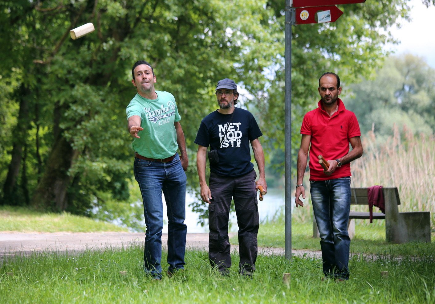 The Arabic-speaking congregation and the German-speaking congregations at the United Methodist church in Aarau, Switzerland, join for barbecue and games at the Aare River. The Rev. Hanspeter Minder (center) is pastor of the German-speaking congregation. Photo courtesy of Bishop Heinrich Bolleter.