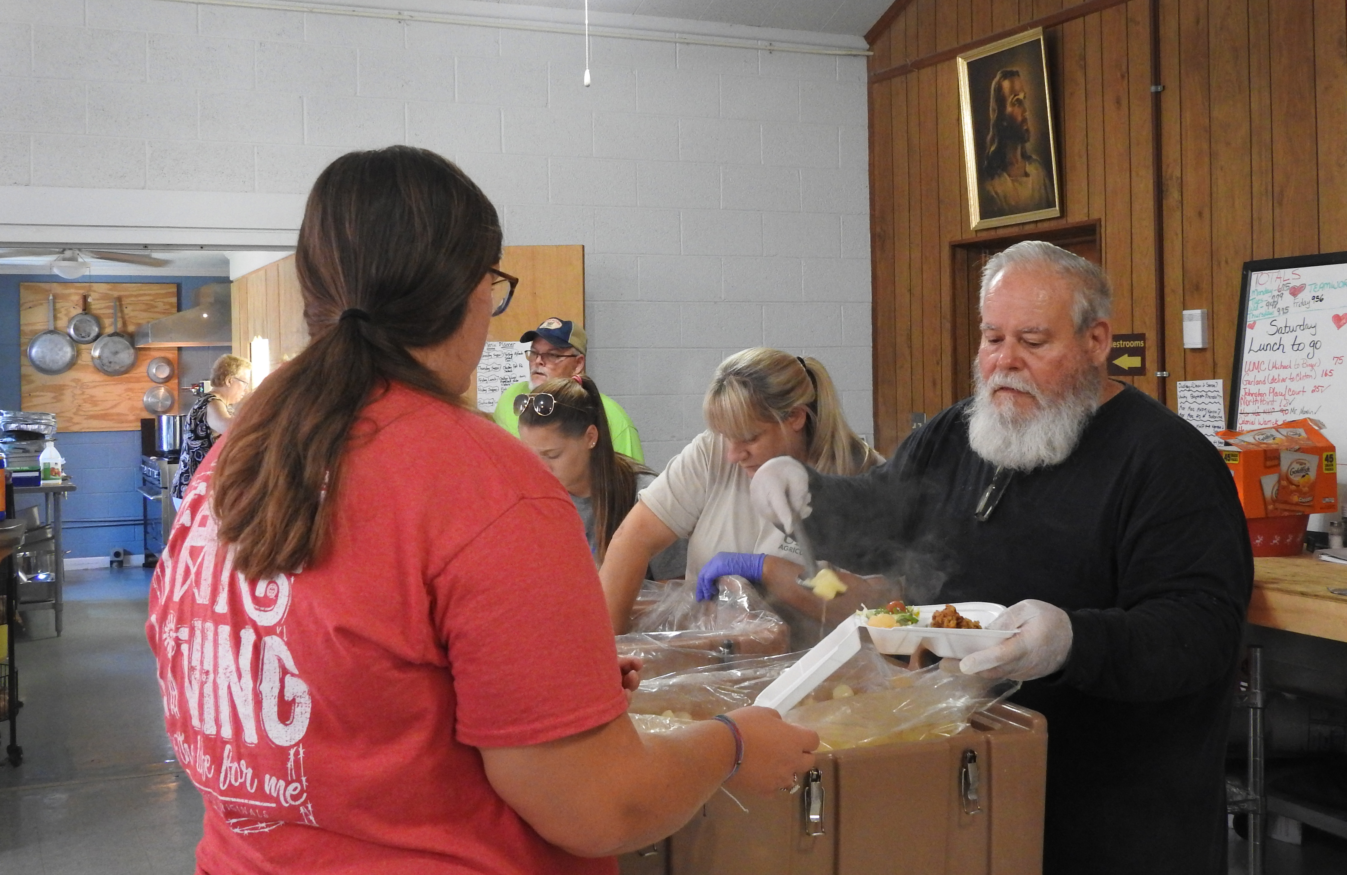 Vounteers at Brogden United Methodist Church in Dudley, North Carolina, prepare meals for Hurricane Florence flood victims. The church has become temporary home to a local food bank that saw its headquarters flooded. Photo by Sam Hodges, UMNS. 