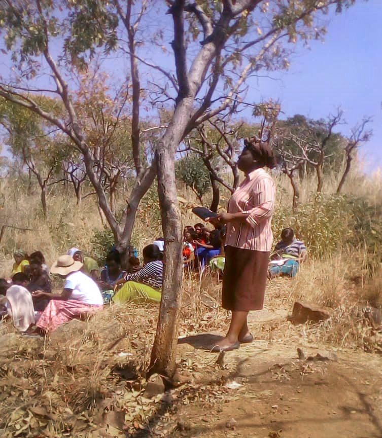 United Methodists pray together at Bindura Mountain, north of Harare, Zimbabwe. Photo by Chenayi Kumuterera.