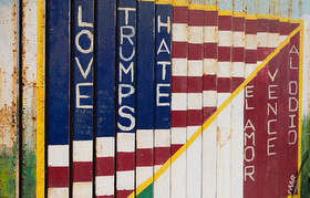 A message of love in two languages decorates the steel beams of the border fence that separates the U.S. from Mexico at El Faro Park in Tijuana, Mexico. Photo by Mike DuBose, UMNS.