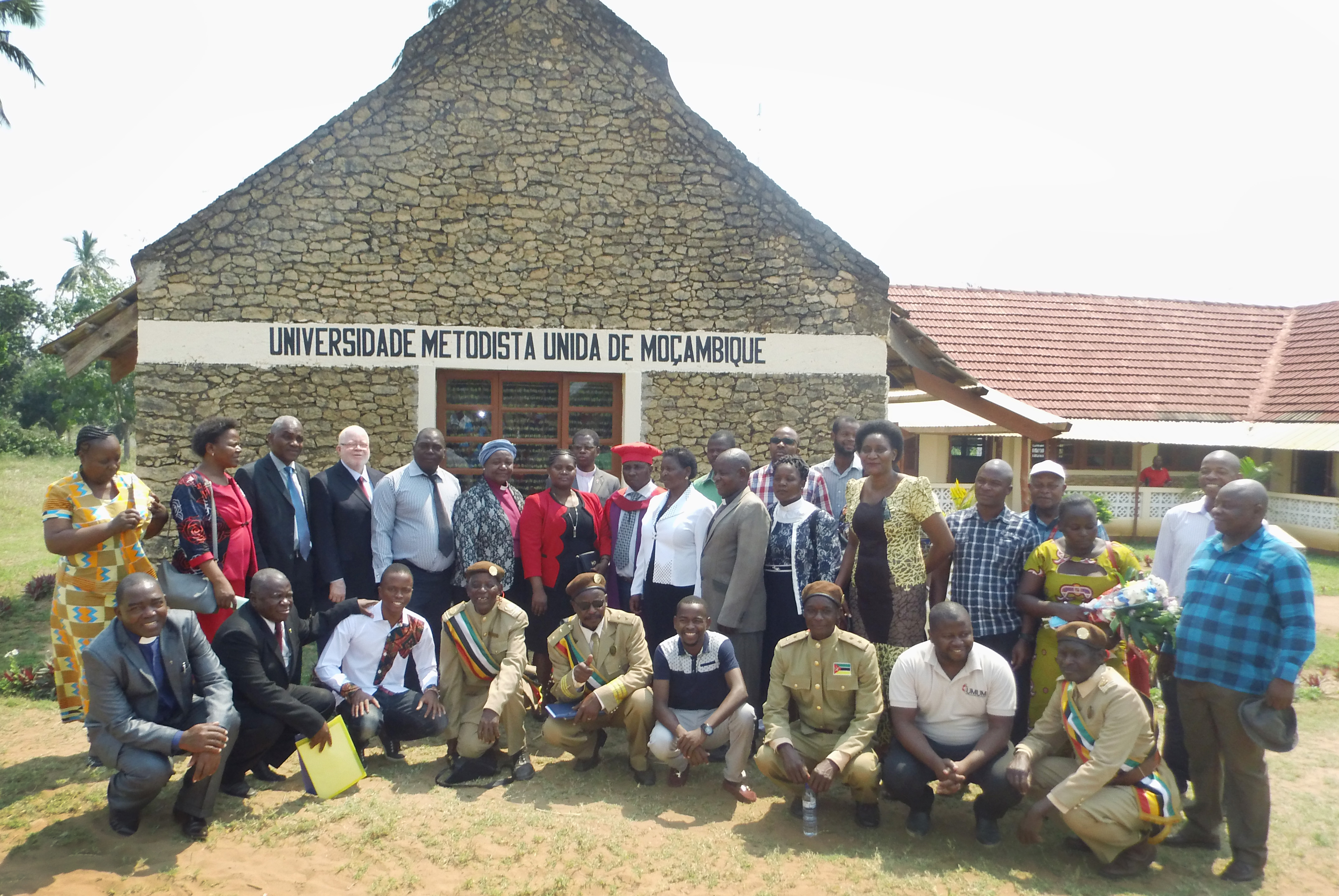 Church, community and government leaders attend a ceremony installing the Rev. Julio Andre Vilanculos (wearing red cap) as new vice chancellor of United Methodist University of Mozambique. The event was held Sept. 20 at Cambine Educational Center in Morrumbene Mozambique. Photo by Francisco Cumbe.