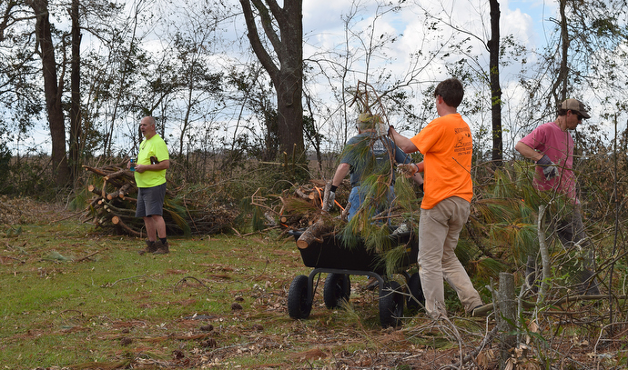 Members of an early response team from the South Georgia Conference of The United Methodist Church clean up storm debris left by Hurricane Michael in Donalsonville, Ga. Photo courtesy of the South Georgia Conference.