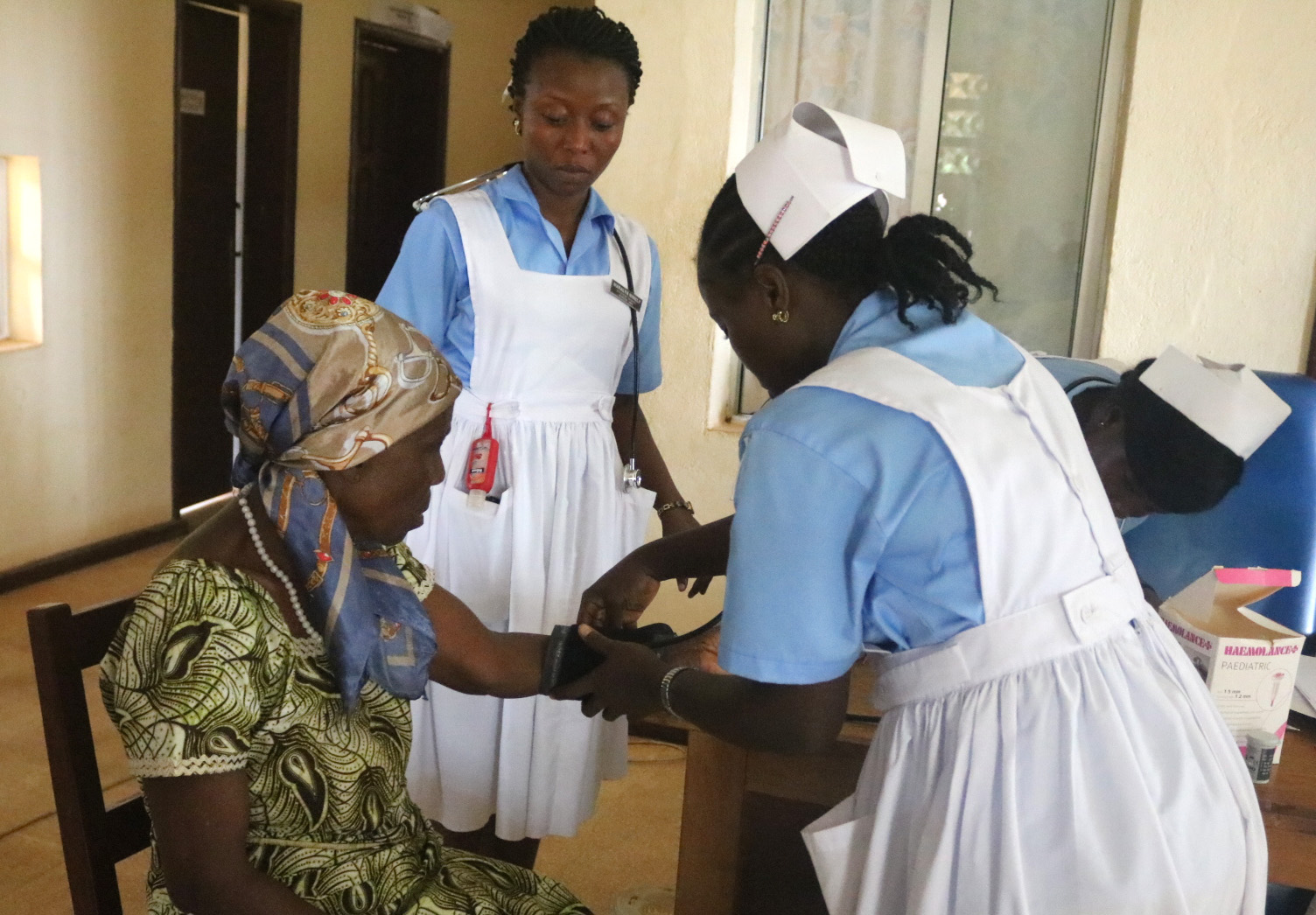 A senior citizen is screened by United Methodist University nursing students in Ganta, Liberia. Photo by E Julu Swen, UMNS.