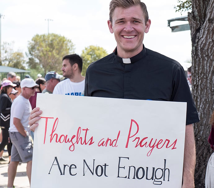 The Rev. Josh Beaty, pastor of discipleship at Christ United Methodist Church, Fort Lauderdale, Fla., was among many United Methodists who participated in the March for Our Lives rally held March 24 in Parkland, Fla. As mass shootings increase in the U.S., churches are considering how far they are willing to go to ensure security. Photo by Kathy L. Gilbert, UMNS.