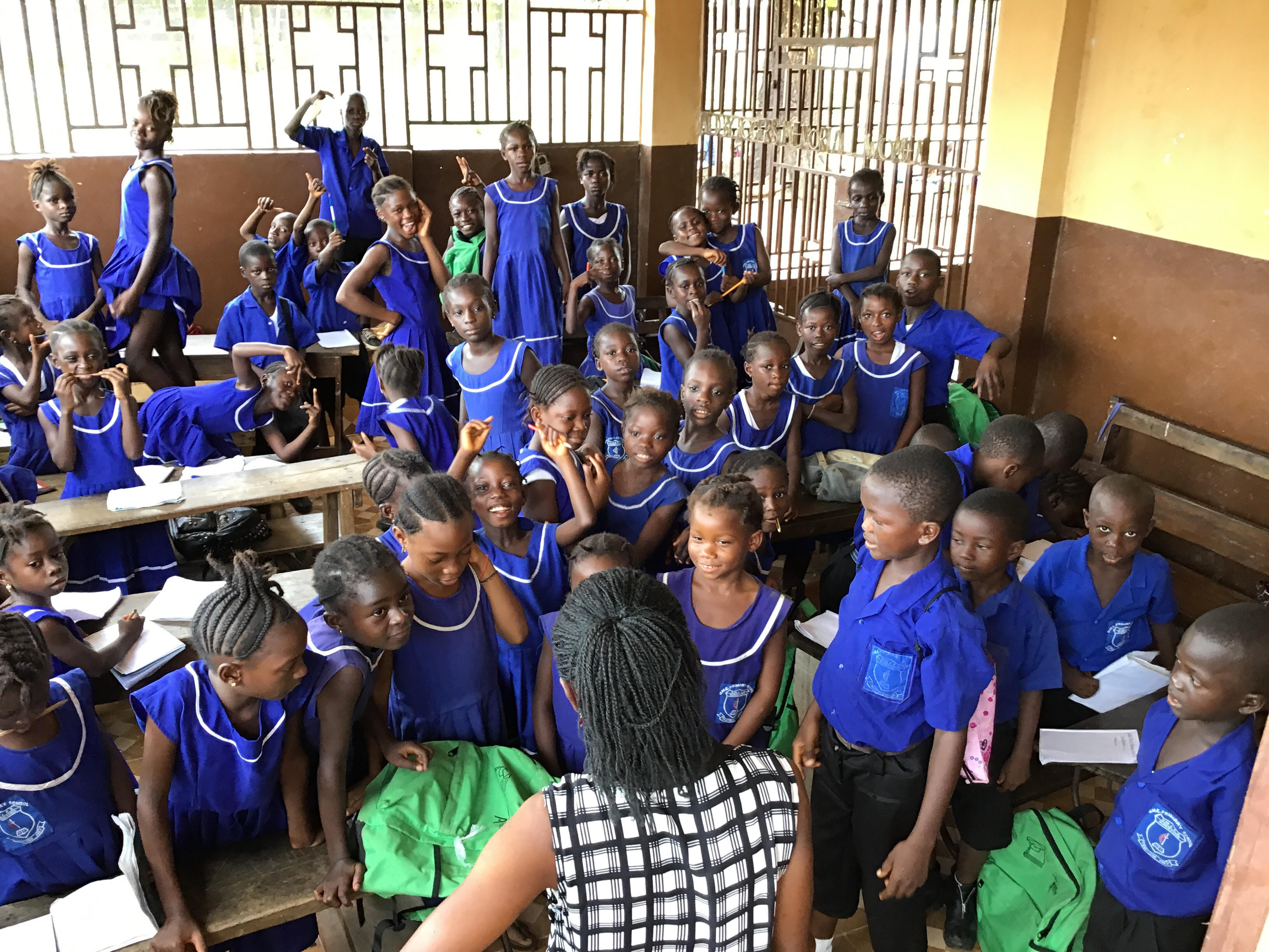 Increased admissions due to the government free education policy have caused some classes of United Methodist Church Primary School in Njagboima to temporarily relocate in the porch of the Rogers Memorial United Methodist Church. Photo by Phileas Jusu, UMNS. 