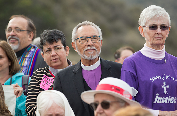 United Methodist Bishop Elias Galvan (center right) and the Rev. Patricia Gandarilla of El Buen Pastor United Methodist Church in Detroit take part in a press conference for faith leaders prior to a march for immigrant rights In San Diego. Photo by Mike DuBose, UMNS.