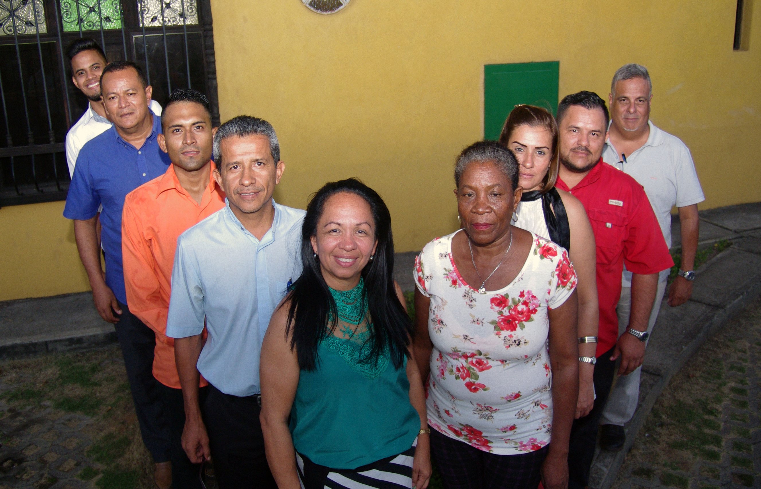 As part of a cultural tradition, delegates from the Council of Evangelical Methodist Churches of Venezuela, left, and the Christian Methodist Community of Venezuela, right, aligned themselves in a "V" shape to symbolize "Venezuela in victory"  at the end of their dialogue. Photo by Gustavo Vasquez, UMNS.