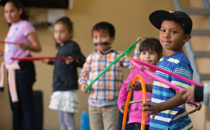 Children watch a skit during the Christmas party. Photo by Mike DuBose, UMNS.