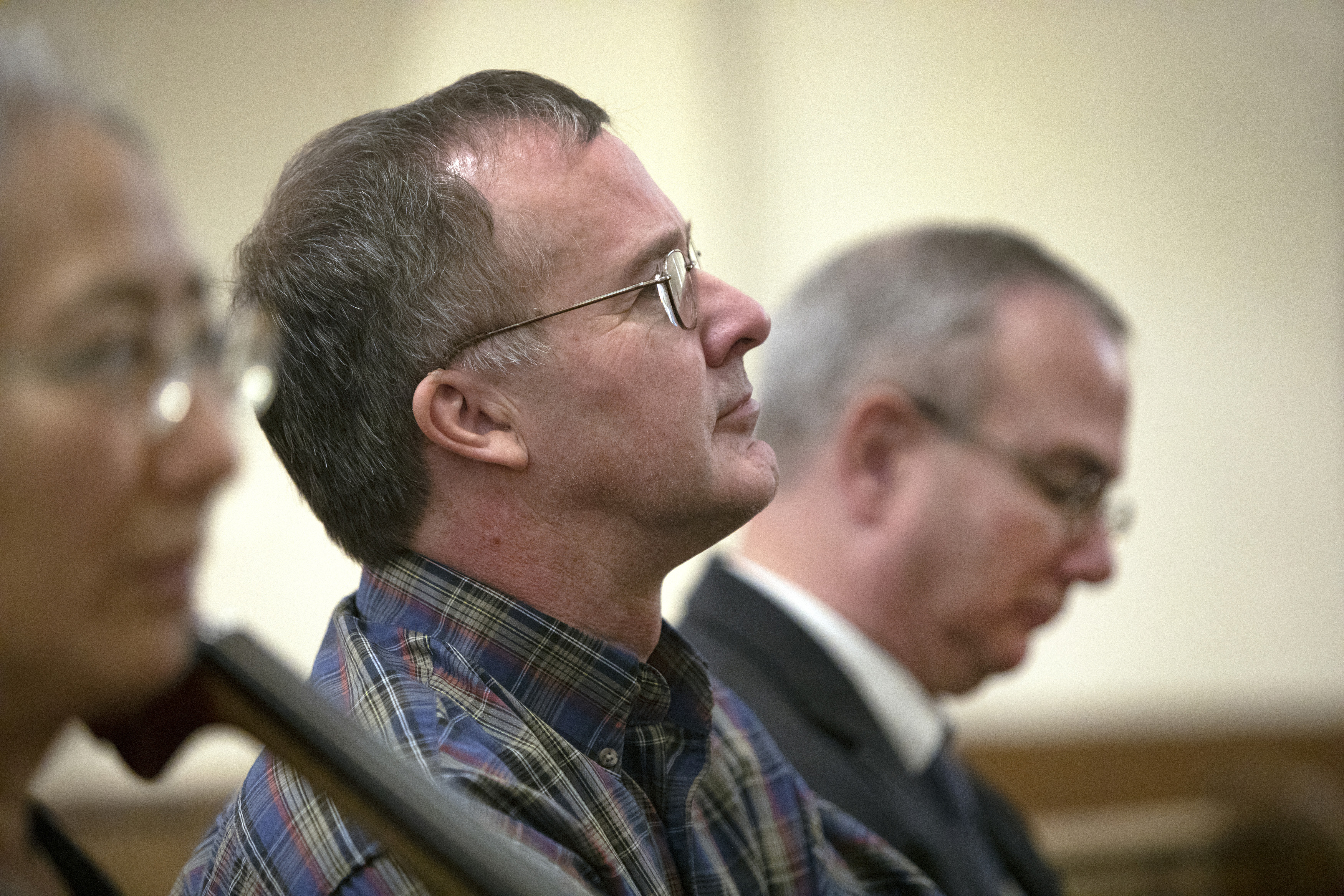 Mike Green and Scott Mills, church historian and music director, listen during the Sunday service at First United Methodist Church. 