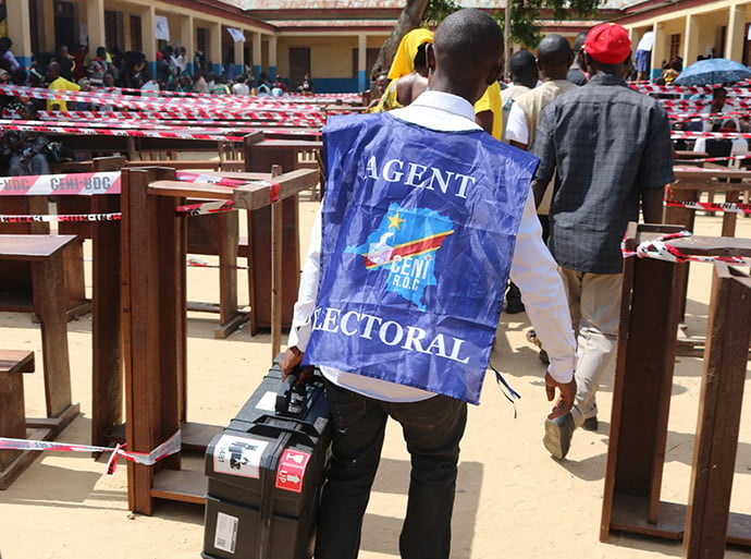 An election agent transports a voting machine to Mwanga Primary School in Kindu, Congo. Elections took place Dec. 30, but allegations of voter fraud continue to mar the first democratic transfer of power since the country’s independence in 1960. Photo by Chadrack Londe, UMNS.