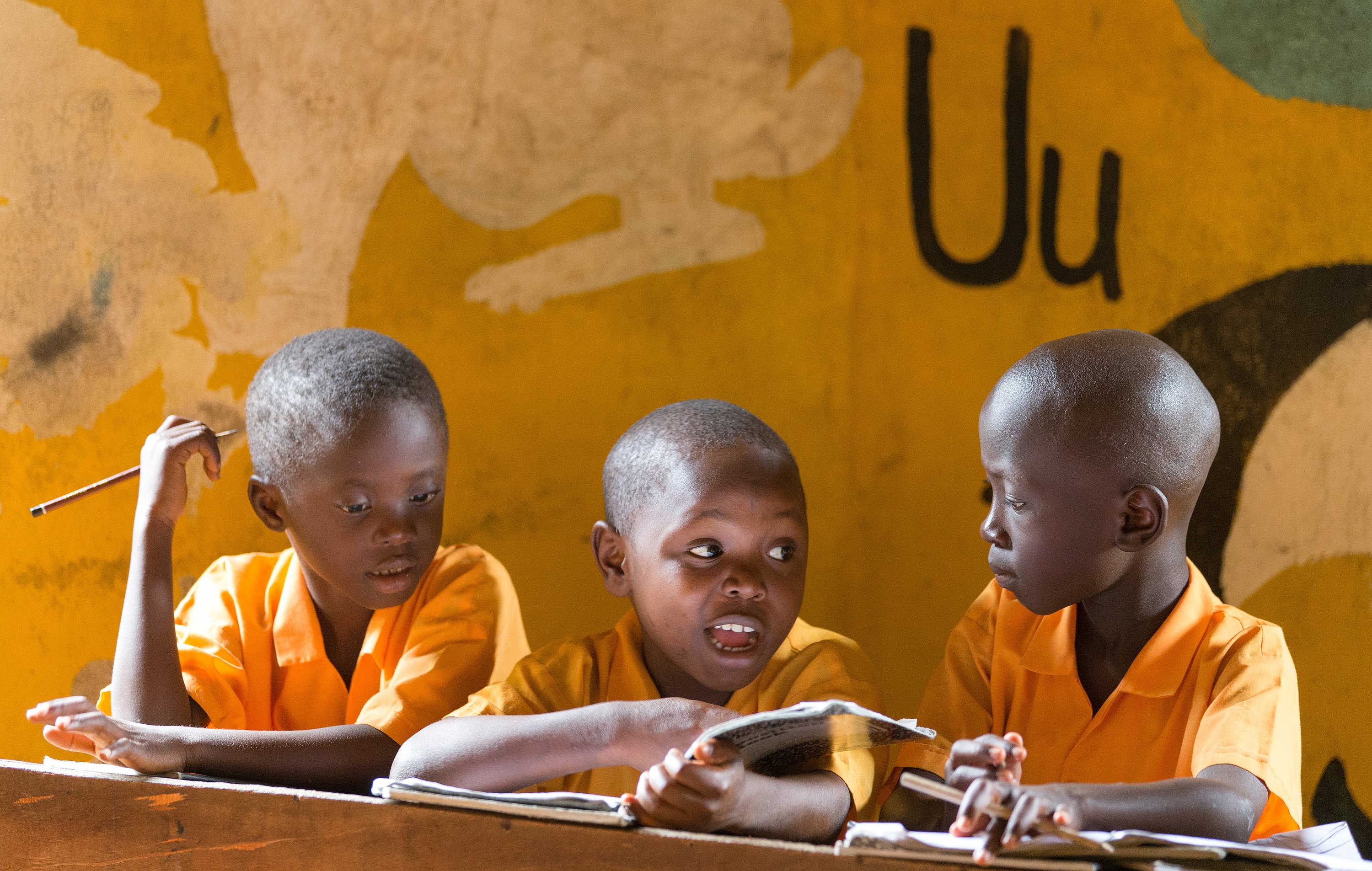 Students work together on spelling words at the Bishop Judith Craig Children's Village in Duahzon, Liberia, in 2017. The facility was established in 2000 to provide care for children left orphaned by Liberia’s civil war. File photo by Mike DuBose, UMNS.