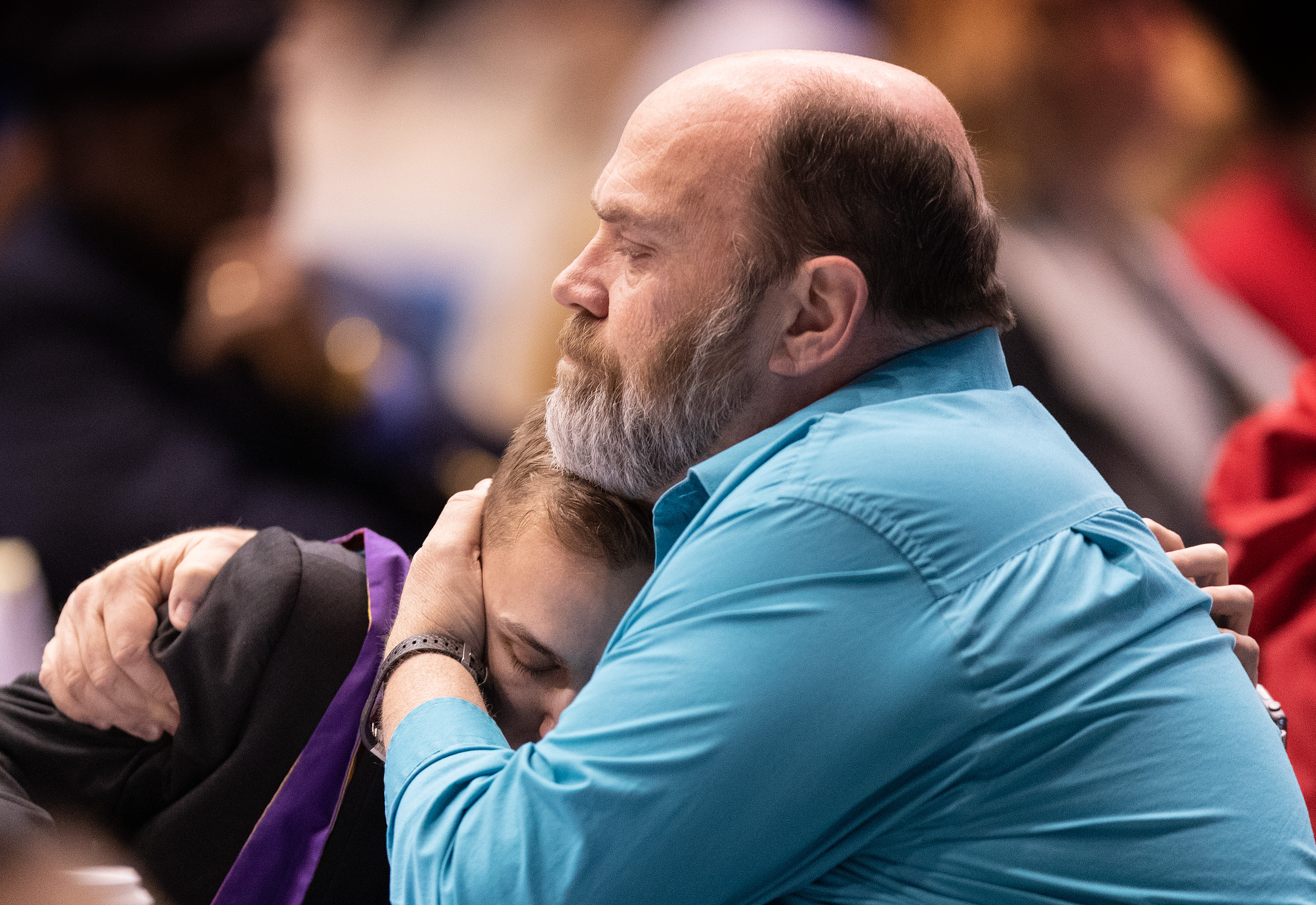 The Rev. Bill Mudge (right) comforts fellow delegate Jeffrey 