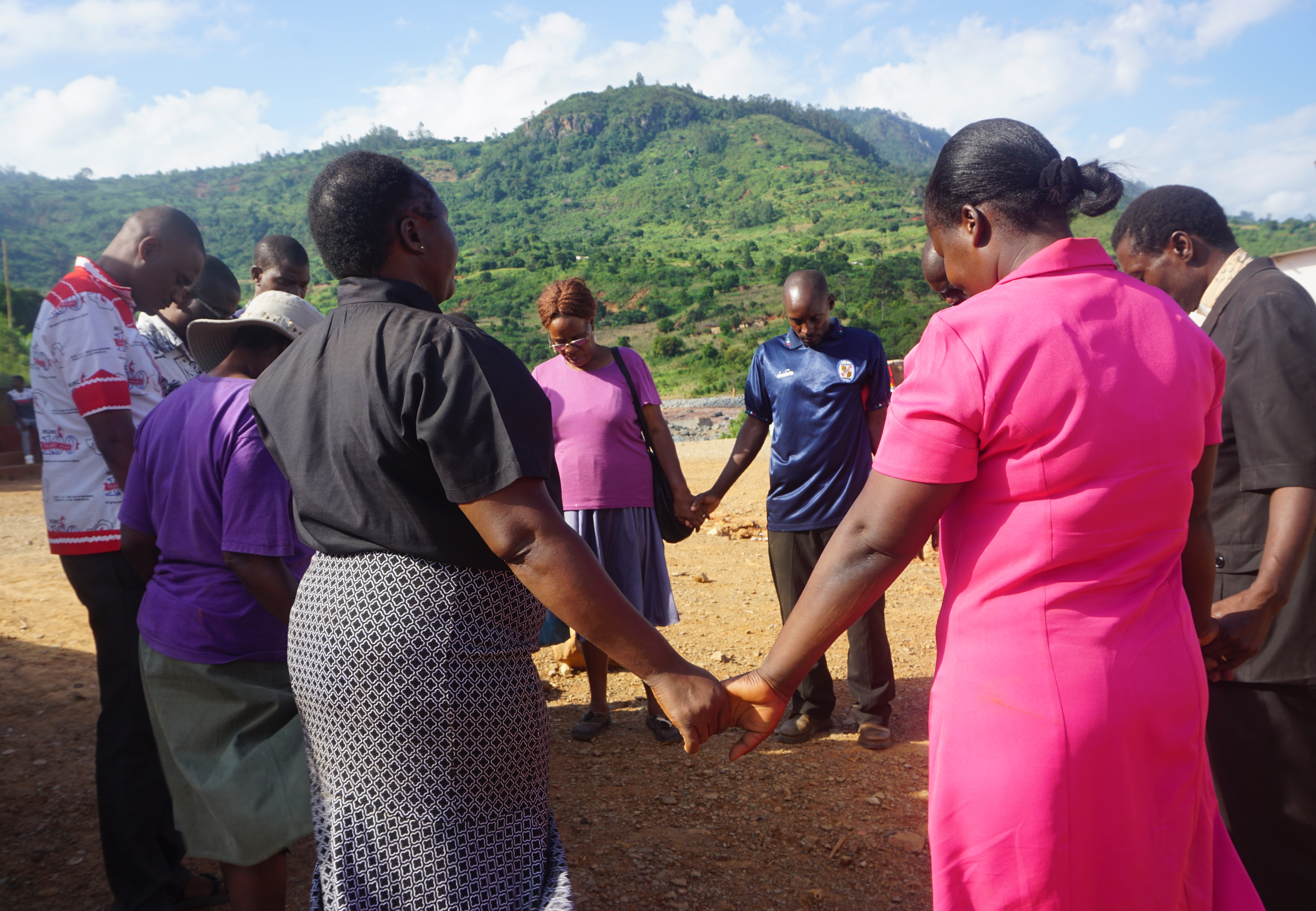 The Rev. Juliet Mwarumba prays with others for hope for the victims affected by the Cyclone Idai in Zimbabwe. Photo by Kudzai Chingwe.  