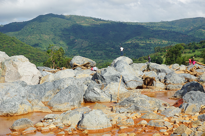 Boulders now sit where houses and a police camp used to be before Cyclone Idai hit Kopa Township, Zimbabwe. Photo by Kudzai Chingwe, UMNS. 