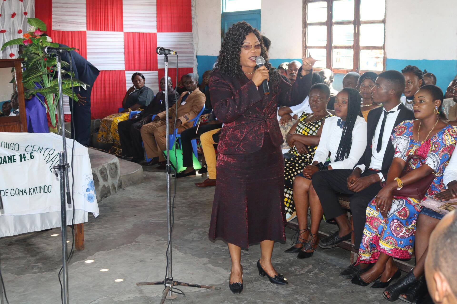 Therese Ndjovu speaks to members of the Amani Local Church at Goma in Kivu about efforts to help widows and children. Photo by Philippe Kituka Lolonga, UMNS.