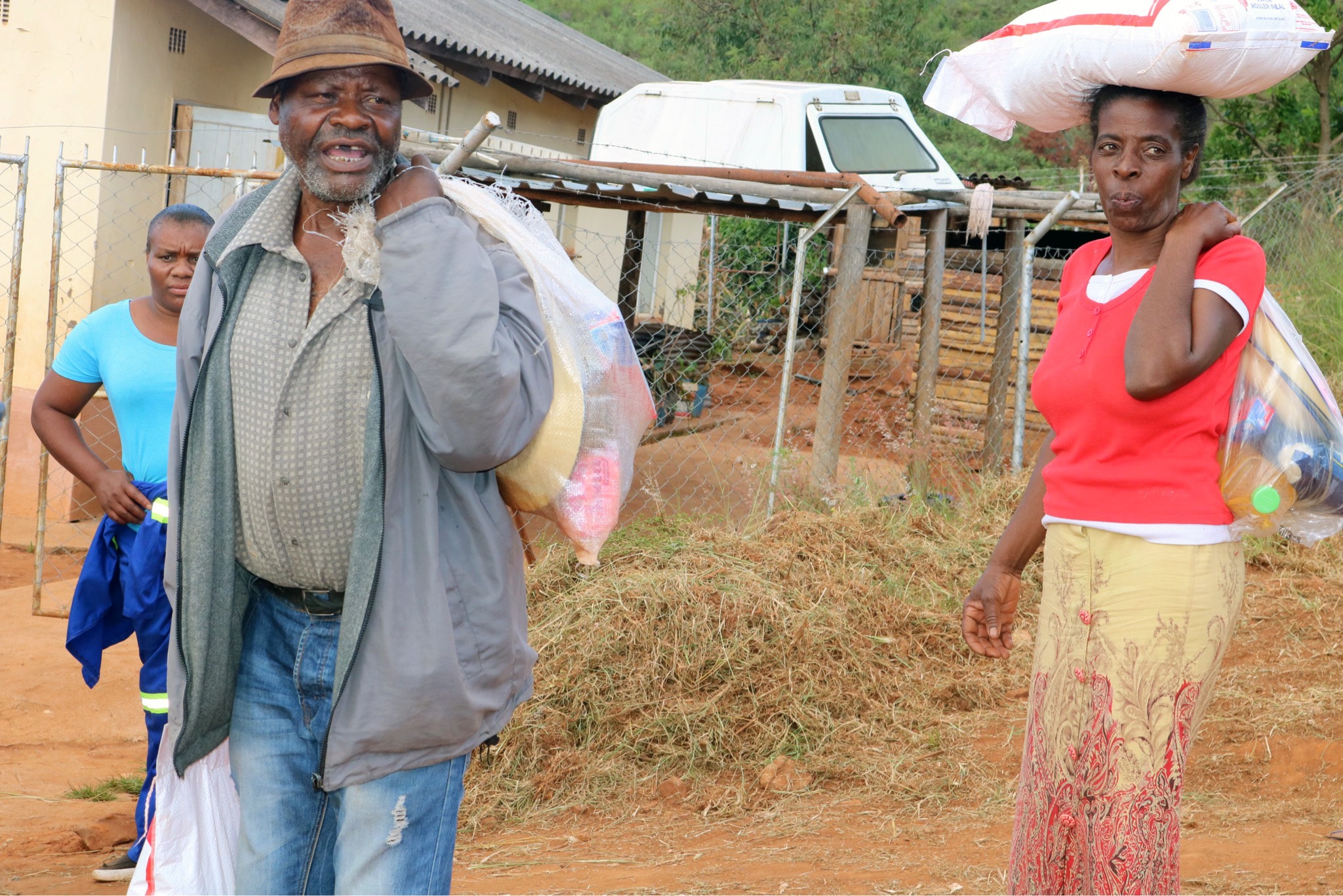 Cyclone Idai survivor Phillip Mushiri, 78, carries food and other supplies handed out by The United Methodist Church in Ngangu, Zimbabwe. Photo by Priscilla Muzerengwa, UMNS.