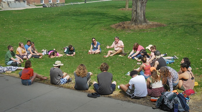 Professor Laird Christensen leads a class outside during the SLATE seminar, an introductory course for first-year students, at Green Mountain College in Poultney, Vt. Photo courtesy of Green Mountain College.