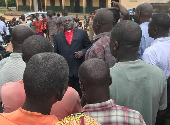 Bishop John Wesley Yohanna, leader of The United Methodist Church in Nigeria, speaks to people at a camp for internally displaced persons in Jalingo, Taraba State. Photo by Tim Tanton, UM News.