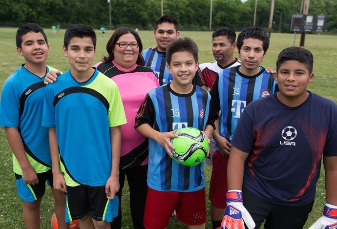 The Rev. Myriam Cortes (third from left) is director of the Ministerio Metodista Ebenezer and a licensed local pastor in The United Methodist Church. The ministry, which is affiliated with 61st Ave. United Methodist Church in Nashville, offers a soccer program for Latino youth. Photo by Mike DuBose, UMNS.