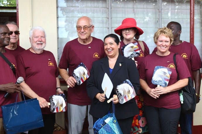 The U.S. ambassador to Sierra Leone, Maria Brewer (center in black coat), meets an Operation Classroom Volunteers in Mission team in Sierra Leone for the dedication of the new Taiama Enterprise Academy in Taiama on Oct. 11. Photo by Phileas Jusu, UM News.