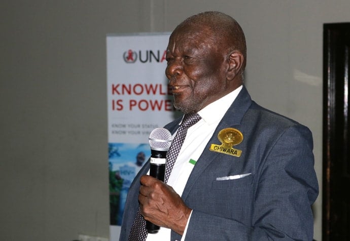 Theologian and traditional African leader Reuben Marinda of the Chiwara dynasty speaks during an HIV-AIDS dialogue in Harare, Zimbabwe. The chief has been a leader in the fight against HIV and AIDS in the country by raising awareness with men and boys. Photo by the Rev. Taurai Emmanuel Maforo, UM News.