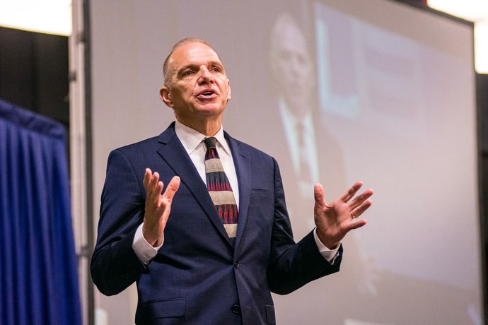 Bishop John Schol tells delegates that “The time has come again for us to be bold and sensitive, to be courageous and humble, to be convicted and searching,” during the special session. Photo by Corbin Payne.