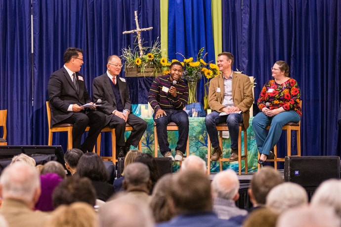 Zach Holder (center) tells the conference how the Way Forward team agreed on recommendations that encourage congregations to develop covenants to be in ministry that are authentic to who they are called to be. Joining Holder, from left: the Rev. Sang Won Doh, Michael Hoon Yan and the Rev. Tom Korkuch and the Rev. Amanda Hemenetz. Photo by Corbin Payne.