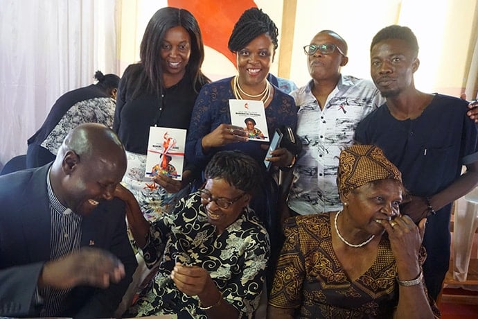 Martha Mudzengerere (seated in center) enjoys a laugh with some of her grandchildren at a Nov. 10 event celebrating her new book, “Old Time Religion.” The 104-year-old is one of the founding members of the Zimbabwe Episcopal Area’s women’s organization. Photo by Kudzai Chingwe, UM News.