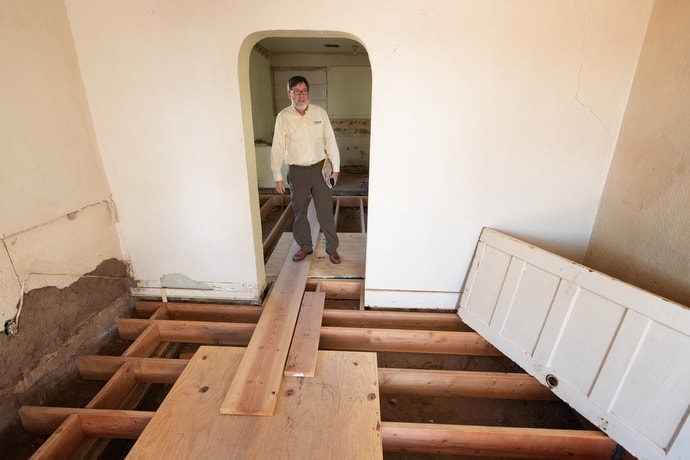 The Rev. Jack Amick of the United Methodist Committee on Relief checks on the progress of renovations at El Calvario United Methodist Church in Las Cruces, N.M. The relief agency is helping support a transitional shelter there for immigrants who have legal documentation that allows them to travel so they can address asylum proceedings in locations close to relatives living in the U.S. Photo by Mike DuBose, UM News.