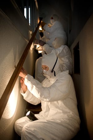 Sue Bymul (front) works with other members of her team from New York to remove a handrail in Alberta Paige’s home. Photo by Mike DuBose, UMNS.