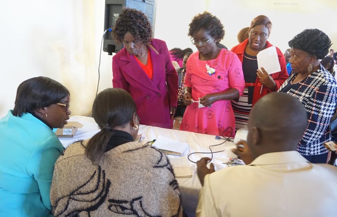 Women line up to contribute toward the construction of Barrington Christian School in Harare, Zimbabwe, during a celebration of its launch. The school, which will be run by United Methodist women, is expected to open its doors in early 2021. Photo by Kudzai Chingwe, UM News.