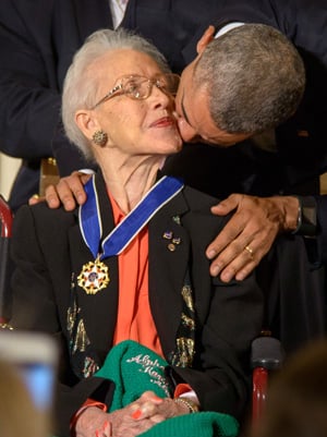 President Barack Obama kisses former NASA mathematician Katherine Johnson after presenting her with the Presidential Medal of Freedom in November 2015, during a ceremony at the White House. Photo by Bill Ingalls, NASA.