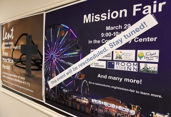 A banner notes the postponement of a planned mission fair at Belmont United Methodist Church in Nashville, Tenn. The continuing spread of COVID-19 is challenging pastors to consider how to do outreach when actually reaching out is difficult at this time. Photo by Mike DuBose, UM News.