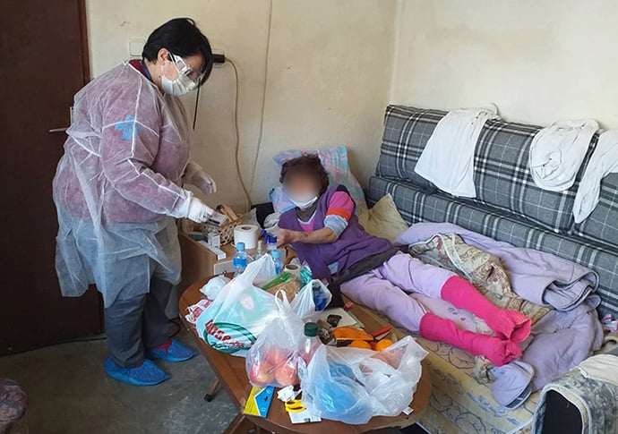 An employee from the Home Care Ministry of The United Methodist Church in Macedonia checks on the welfare of a client at her home in Strumica. The client’s face was blurred to protect her privacy in this photo provided by the Home Care Ministry. Photo courtesy of The United Methodist Church in Macedonia.