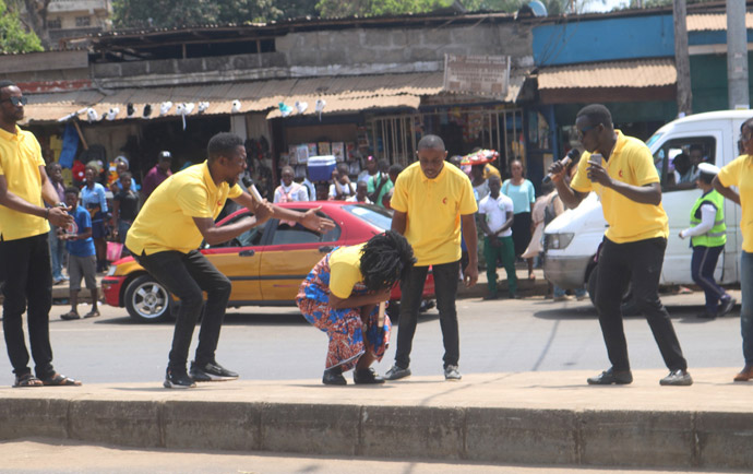 United Methodist young adults in eastern Freetown, Sierra Leone, act out a skit March 25 to share information about the coronavirus. The campaign — sponsored by the Missions and Development Department of the Sierra Leone Conference — was aimed at preparedness, prevention, control and dismissing denials and myths about the pandemic. Photo by Phileas Jusu, UM News. 