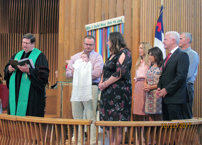 Admiral Brett Giroir and wife Jill Giroir, with other family members, attend the baptism of their first grandchild, a happy event held at Lovers Lane United Methodist Church in Dallas. Brett Giroir, a physician and public health specialist, currently leads the federal effort to expand testing for the coronavirus. He and his wife are counting on being back at Lovers Lane for the baptism of their second grandchild, but it’s unclear when that can happen because of coronavirus-related meeting restrictions. Photo courtesy of Jill Giroir.