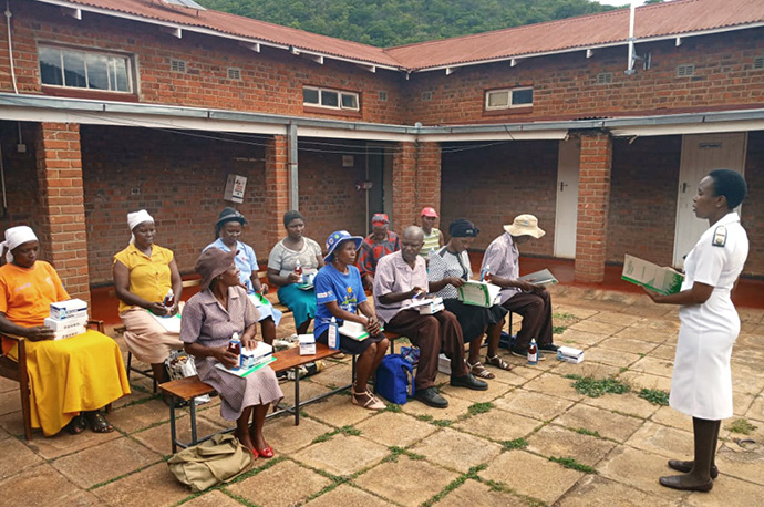 Angela Macherechedze, sister in charge of the family and child health unit at United Methodist Old Mutare Mission Hospital, educates village health workers about the outbreaks of malaria and COVID-19 during training at Old Mutare Mission Hospital in Mutare, Zimbabwe. Photo by Kudzai Chingwe, UM News.