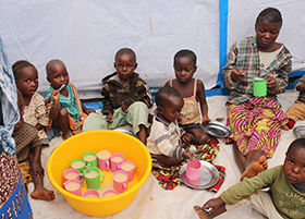 Children eat porridge at United Methodist Irambo Health Center in Bukavu, Congo, during the COVID-19 pandemic. Photo by Philippe Kituka Lolonga, UM News.