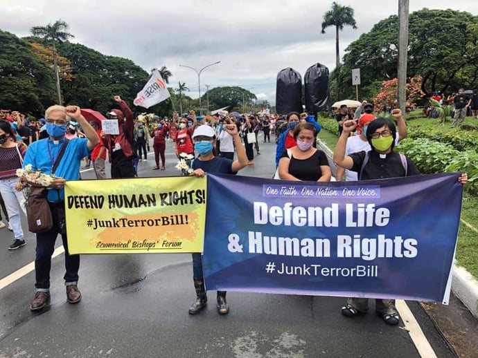 United Methodists join a massive protest against the anti-terrorism bill at the University of the Philippines in Quezon City, Manila. Groups represented by banners at the protest included the Ecumenical Bishops Forum, Rise Up for Life and for Rights and One Faith. One Nation. One Voice. Photo courtesy of Arceli Bile.