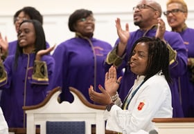 Bishop Cynthia Moore-Koikoi sings with members of the Anointed Voices choir at Ben Hill United Methodist Church in Atlanta where members of Black Methodists for Church Renewal worshipped during their 2019 meeting. Moore-Koikoi is part of a churchwide campaign to dismantle racism. File photo by Mike DuBose, UM News.