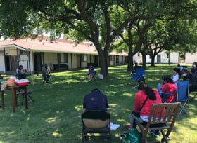 The Cambodian congregation at Point Pleasant United Methodist Church in the California-Nevada Conference holds their Sunday morning outdoor worship service while observing social distancing protocols. Photo by Savanna Thaing.