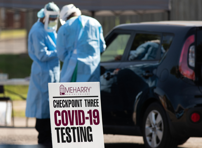 Volunteers from Meharry Medical College prepare to help patients at a drive-thru testing site for COVID-19 at St. Luke Christian Methodist Episcopal Church. Teams from the school have been offering testing at area churches on Saturdays. Photo by Mike DuBose, UM News.