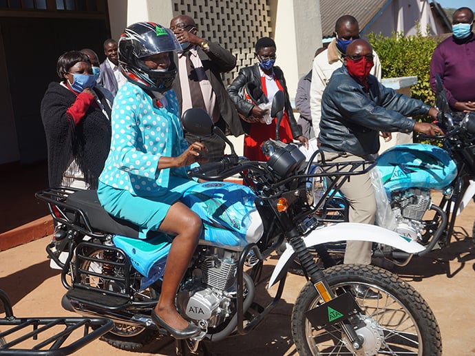 The Revs. Sandra Hakuna and Shepherd Nyakatsapa try out new motorbikes donated by church partners during a handover ceremony at Old Mutare United Methodist Church in Mutare, Zimbabwe. The pastors will use the bikes to conduct ministry in rural parts of the country. Photo by Kudzai Chingwe, UM News.