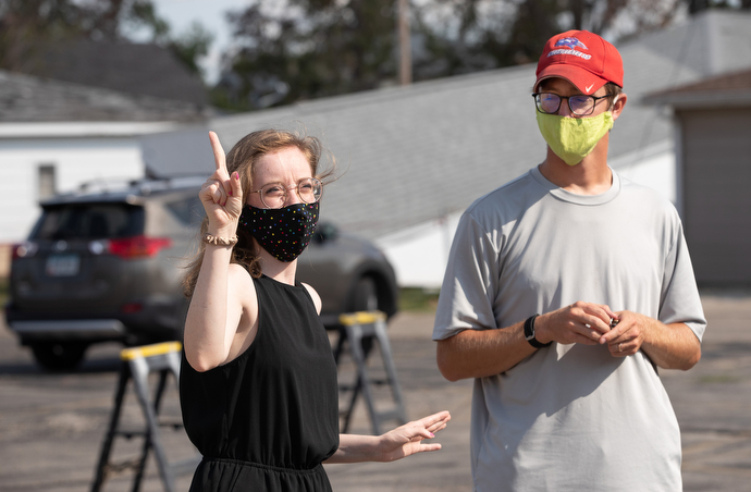 The Rev. Nick Grove and his wife, Chelsey, relate their experiences with the derecho that struck their neighborhood in Cedar Rapids, Iowa, Aug. 10. Nick, pastor of Sharon United Methodist Church, said the parsonage was without power for a week. Photo by Mike DuBose, UM News.