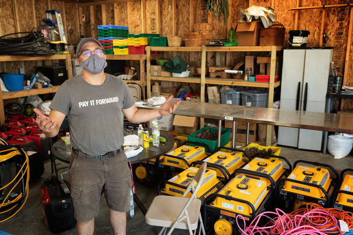 Tim Salis has been pressed into service managing the distribution and maintenance of borrowed electrical generators to help those who lost power in an Aug. 10 derecho. He normally serves as chef at the Groundswell Cafe, part of the Matthew 25 community organization in Cedar Rapids, Iowa, which provides access to fresh, healthy food to everyone, regardless of their ability to pay. Photo by Mike DuBose, UM News.