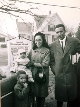 The Rev. Gil Caldwell stands outside of Bryantville United Methodist Church in Pembroke, Mass., with his wife, Grace Caldwell, and two sons in this undated photo. Caldwell served as senior pastor of five predominantly African American churches and four mostly white churches over six decades. Photo courtesy of UMC.org. 