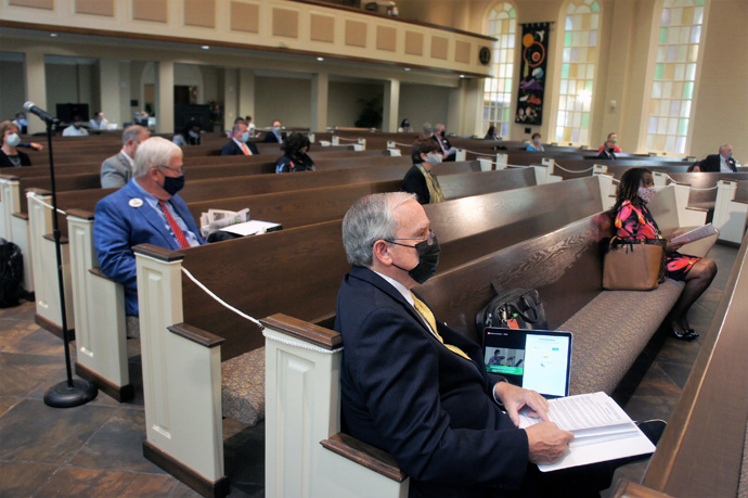 A smattering of clergy and laity meet at Germantown United Methodist Church, under pandemic protocols, for a Memphis Annual Conference session that hundreds of others attended online. Most U.S. annual conferences of The United Methodist Church had their yearly meetings virtually because of the COVID-19 threat. Photo by Lane Gardner Camp, courtesy of the Memphis Annual Conference.