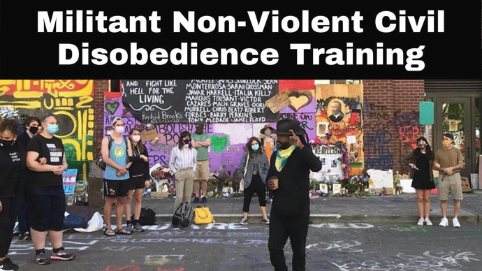 The Rev. Osagyefo Sekou, theologian-in-residence at the Valley & Mountain church in Seattle, leads a civil disobedience training session. Photo courtesy of the Rev. John Helmiere.